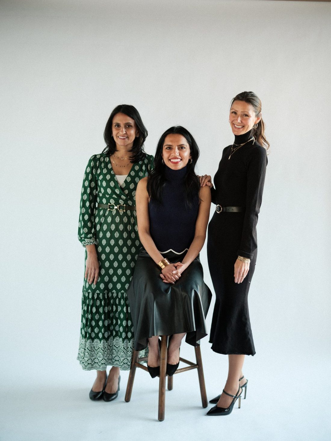 Thimble & Thread founder Gunjan Sud (center) with two women from the Thimble & Thread community, smiling together